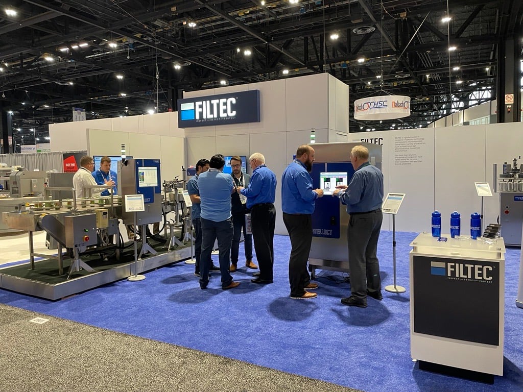 Global Product Manager Dave Coleman speaking with attendee at PACK EXPO 2022